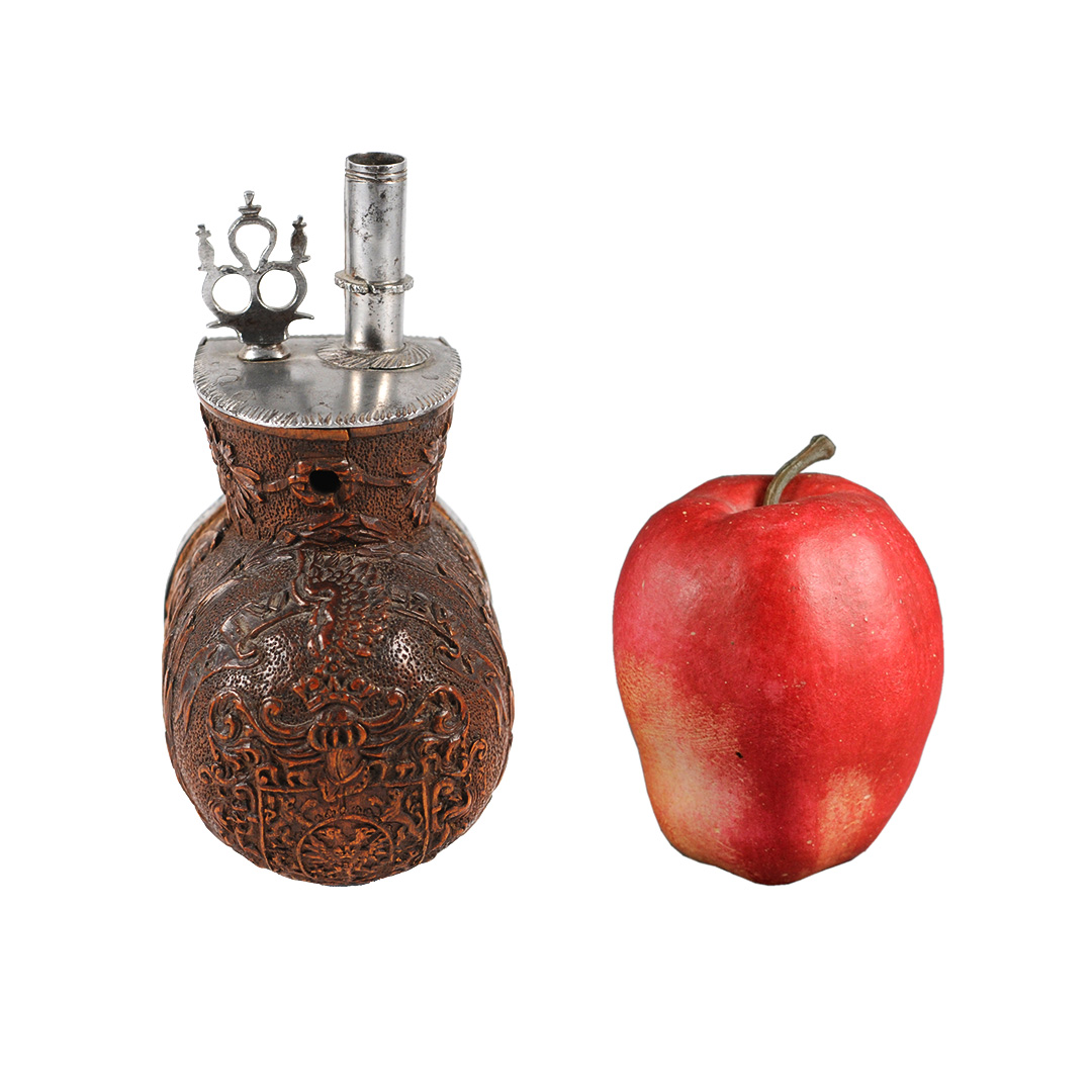 A boxwood powder flask - dated "1656"