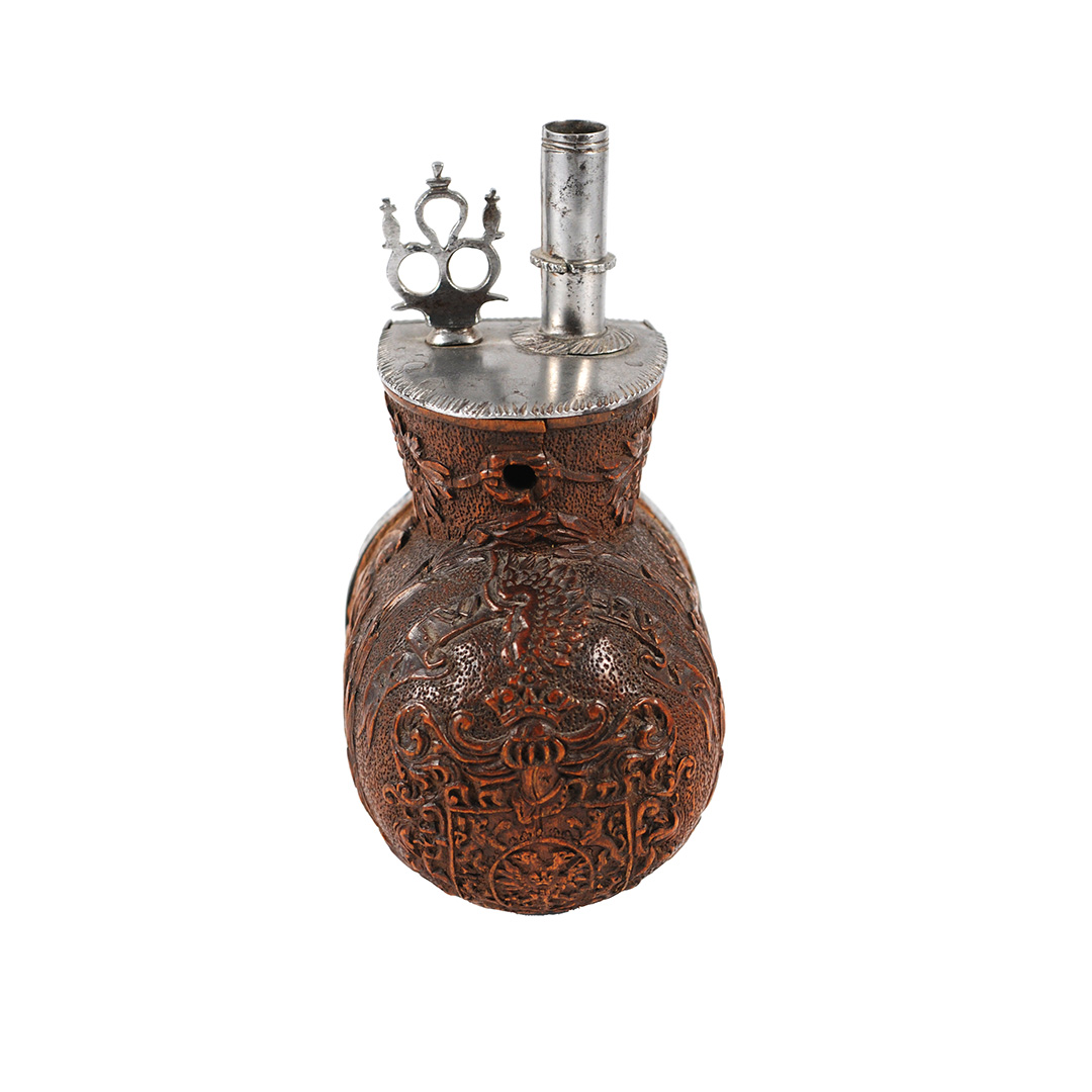 A boxwood powder flask - dated "1656"