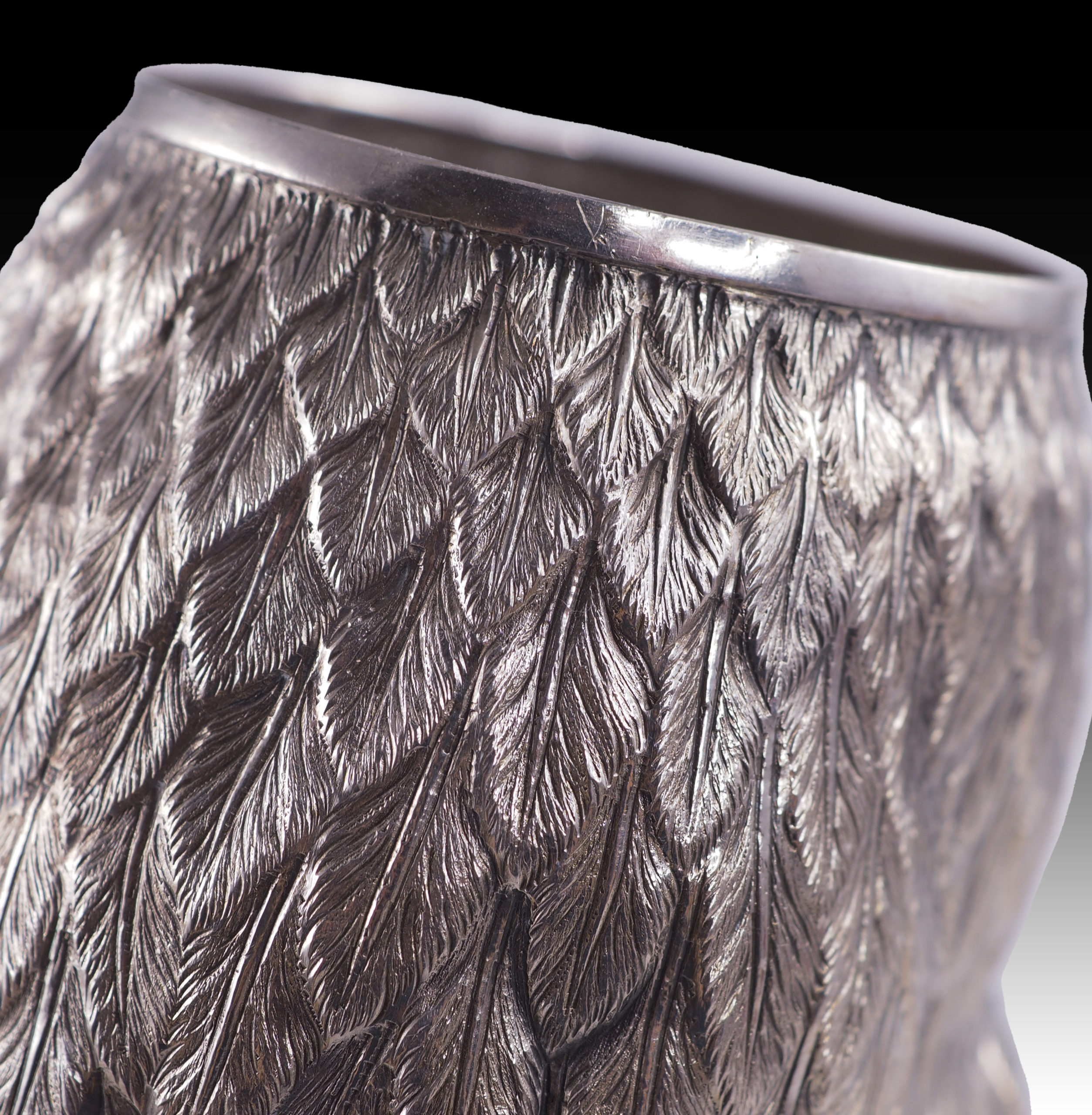 A silver drinking vessel in the shape of an owl