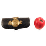 Prussia - Cartridge case for field artillery crews, model 1874 Black lacquered leather case with applied brass fittings. Three-piece flamed grenade with crowned monogram "FRW" (joined).