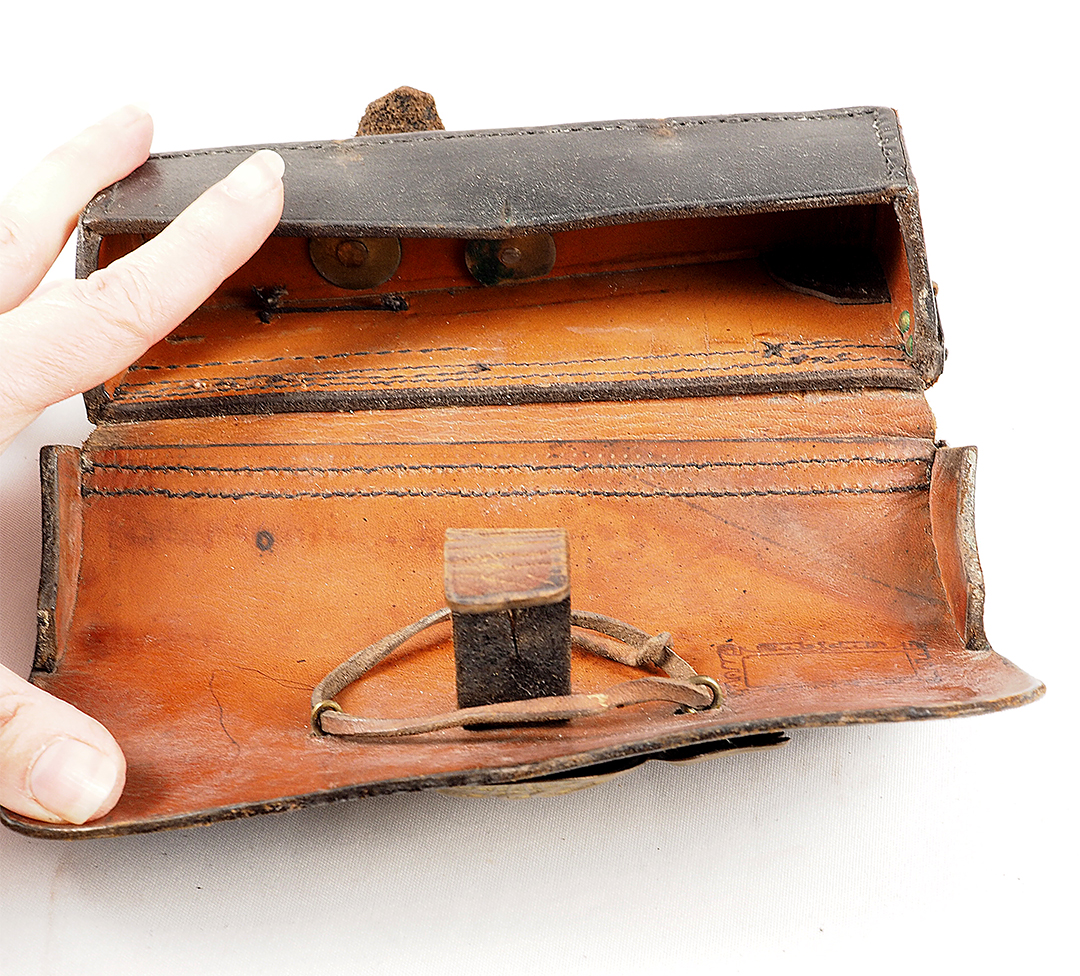 Prussia - Cartridge case for field artillery crews, model 1874 Black lacquered leather case with applied brass fittings. Three-piece flamed grenade with crowned monogram "FRW" (joined).