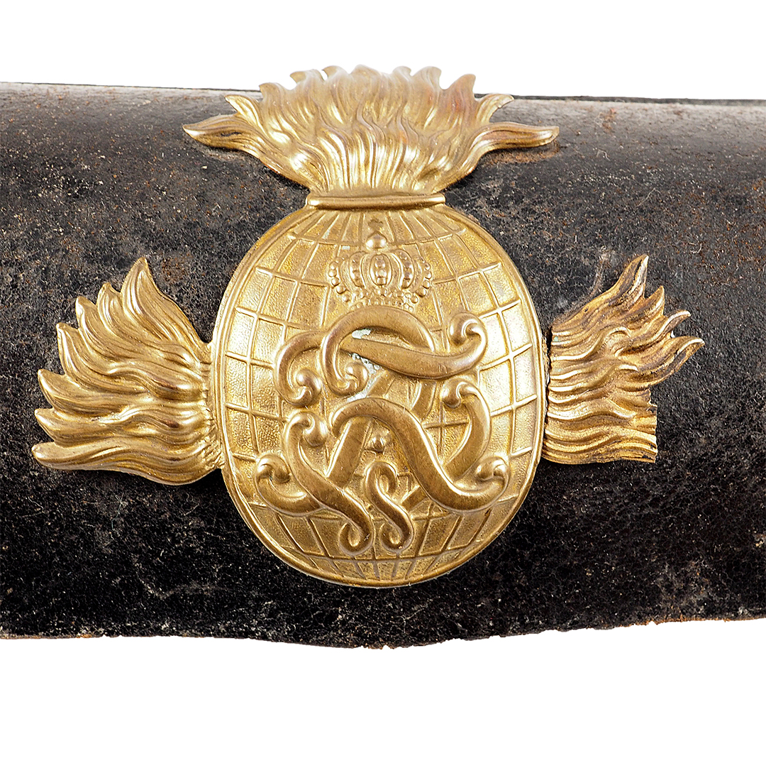 Prussia - Cartridge case for field artillery crews, model 1874 Black lacquered leather case with applied brass fittings. Three-piece flamed grenade with crowned monogram "FRW" (joined).